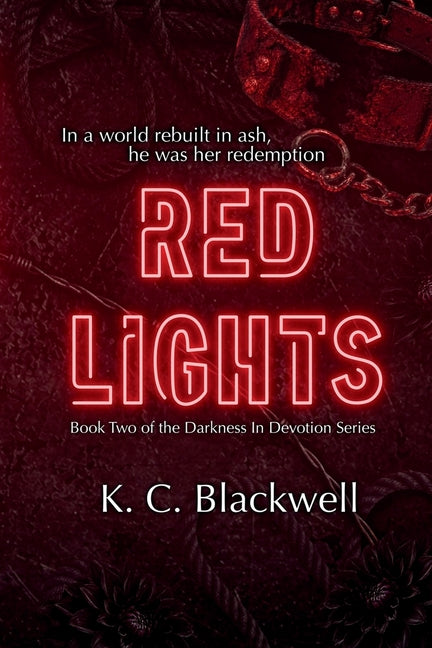 Red Lights paperback book by K.C. Blackwell, featuring a vibrant cover with red and black design elements.