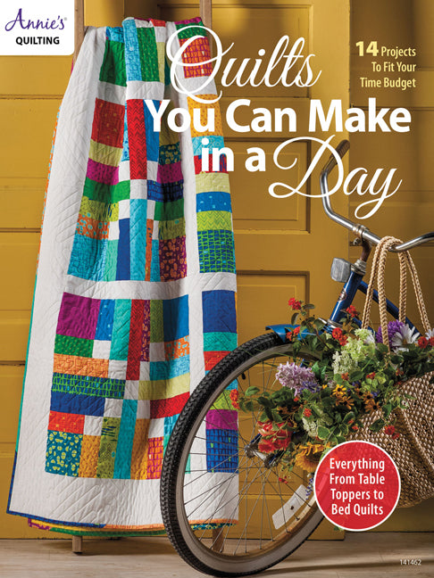 Paperback book titled "Quilts You Can Make in a Day" by Annies, featuring colorful quilt patterns on the cover.