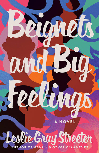Paperback of Beignets and Big Feelings by Lake Union Publishing showing the front cover with colorful illustrations.