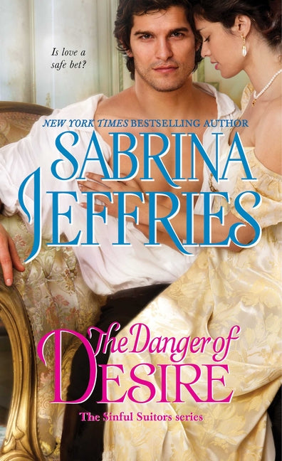 Paperback novel titled The Danger of Desire by Gallery Books, showing the front cover with dark and fiery design elements.