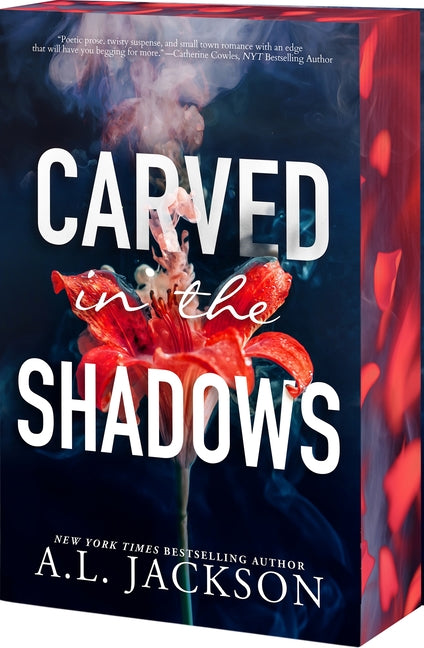 Paperback copy of "Carved in the Shadows" by Entangled: Amara, showing the book cover with dark, shadowy artwork.