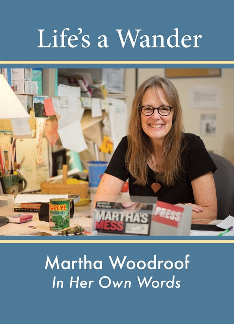 Paperback book titled "Life's a Wander" by Martha Woodroof, published by Cove River Press, with cover featuring her portrait.