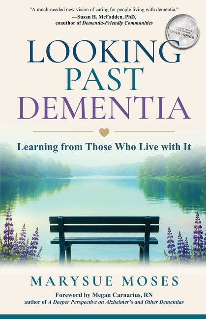 Paperback book titled "Looking Past Dementia" by Emerald Lake Books, featuring a cover with abstract artwork.