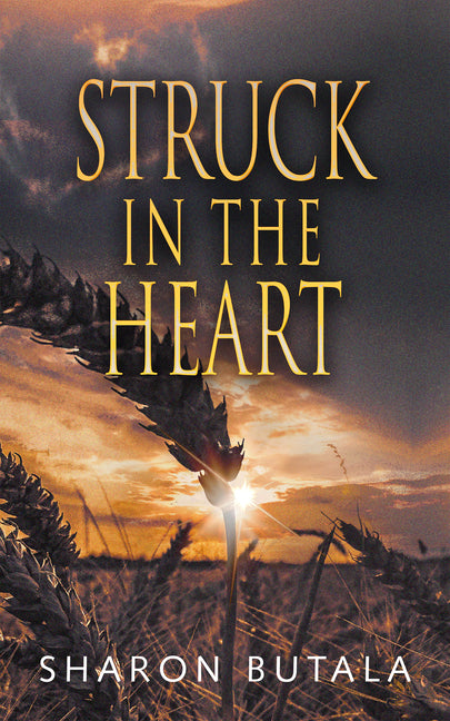 Paperback of "Struck in the Heart" by Shadowpaw Press, featuring the book cover with dark artistic design.