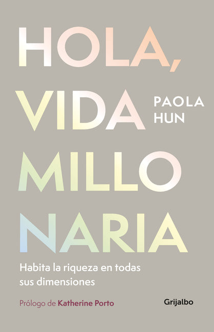 Paperback book titled "Hola, Vida Millonaria" by Grijalbo, featuring the cover with colorful design and the title visible.