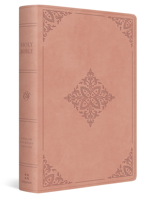 Large print Crossway ESV Bible with blush rose Trutone cover featuring fleur-de-lis design, open to pages with text and ribbon marker.