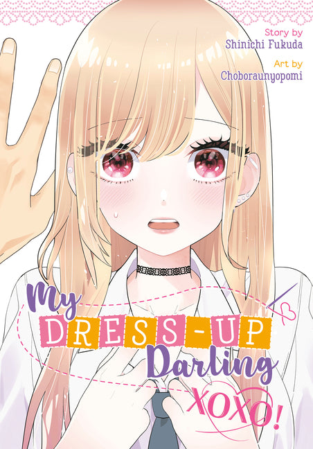 Square Enix Manga My Dress-Up Darling Xoxo! paperback book with colorful cover featuring characters from the manga series.