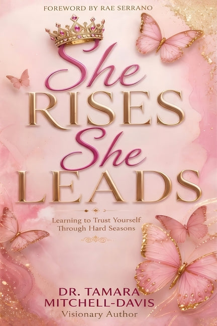 Paperback book titled "She Rises. She Leads." by TM Davis Enterprise LLC, featuring a cover with empowering design and inspirational text.