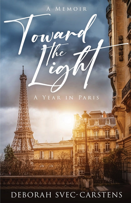 Paperback copy of "Toward the Light: A Year in Paris" by Spiral Staircase Press, showing the book cover with title and author details.