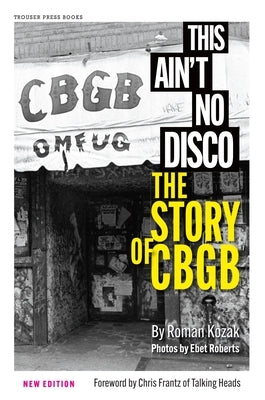 Paperback copy of "This Ain't No Disco: The Story of CBGB" by Trouser Press Books, featuring the book cover with bold title text.