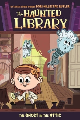 Paperback of The Ghost in the Attic by Grosset & Dunlap, showing the book cover with spooky illustration and title text.
