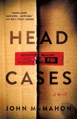 Paperback book titled "Head Cases" by Minotaur Books, with a dark cover featuring abstract artwork and the title prominently displayed.