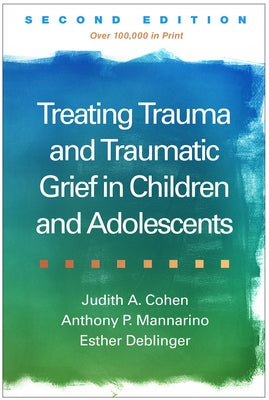 Paperback of "Treating Trauma and Traumatic Grief in Children and Adolescents" by Guilford Publications, with book cover and title visible.