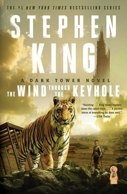Paperback copy of The Wind Through the Keyhole novel by Scribner Book Company, featuring a cover image with mystical artwork.