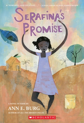 Paperback copy of Serafina's Promise by Scholastic Press, featuring the book cover with colorful illustration.