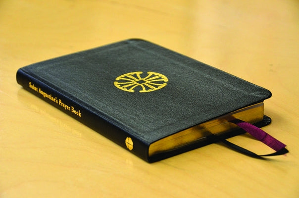 Leather Saint Augustine's Prayer Book with gold embossing, featuring religious text and prayer pages from Forward Movement Publications.