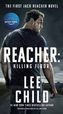 Mass market paperback of "Reacher: Killing Floor" by Berkley Books, featuring the book cover with title and author details.