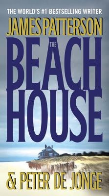 Cover of The Beach House mass market paperback by Little Brown and Company, featuring a coastal scene with a house and ocean.