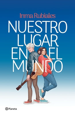 Paperback novel "Nuestro Lugar En El Mundo" by Planeta Publishing, featuring a colorful cover image.