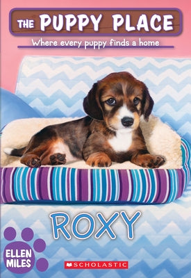 Paperback book titled "Roxy" from The Puppy Place series, Volume 55, by Scholastic Paperbacks, featuring a dog on the cover.