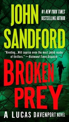 Broken Prey mass market paperback by G.P. Putnam's Sons featuring a suspenseful cover with a dark cityscape and mysterious figures.