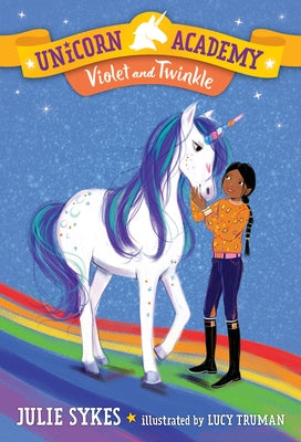 Paperback of Unicorn Academy #11: Violet and Twinkle by Random House Books for Young Readers, featuring colorful unicorn illustrations.