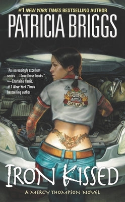 Cover of Iron Kissed mass market paperbound book by Ace Books, featuring dark fantasy artwork and title text.