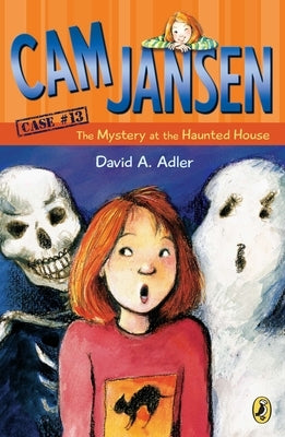 Paperback of Cam Jansen: The Mystery at the Haunted House book by Penguin Young Readers Group, showing the cover with spooky house illustration.