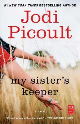 Paperback copy of "My Sister's Keeper" by Atria Books, featuring the book cover with title and author details.