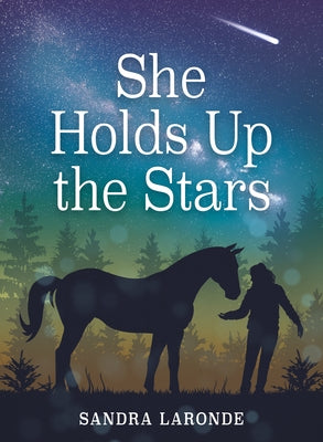 Paperback copy of "She Holds Up the Stars" by Annick Press showing the book's cover with celestial artwork and title.