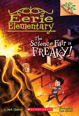 Paperback book titled "The Science Fair Is Freaky!" from Eerie Elementary series by Scholastic Inc., featuring spooky school illustrations.