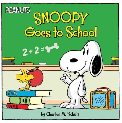 Paperback book titled "Snoopy Goes to School" by Simon Spotlight featuring Snoopy sitting at a school desk.