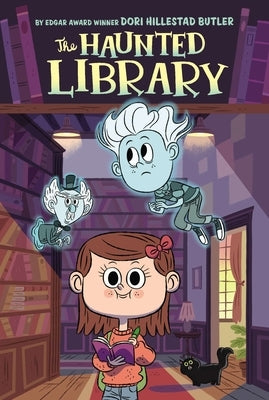 Paperback of The Haunted Library by Grosset & Dunlap, featuring a spooky book cover with haunted house and ghost illustrations.