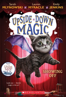 Showing Off paperback book from Upside-Down Magic #3 series by Scholastic Inc., front cover with colorful illustrations.