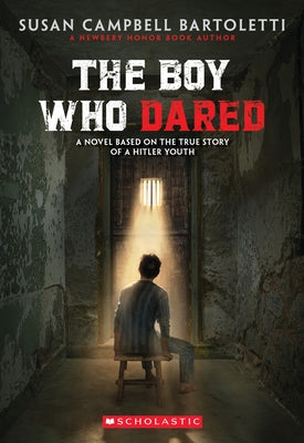Paperback of "The Boy Who Dared" by Scholastic Press, showing the book cover with title and author details.