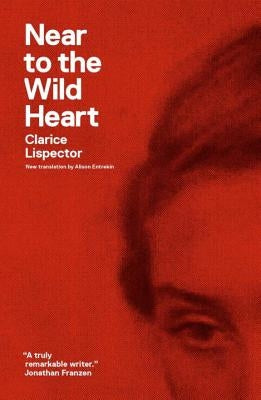 Paperback copy of "Near to the Wild Heart" by New Directions Publishing Corporation, featuring the book cover with artistic design.