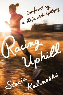Paperback book titled "Racing Uphill: Confronting a Life with Epilepsy" by University of Minnesota Press, featuring a cover image.