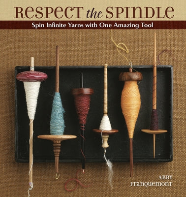 Paperback book titled "Respect the Spindle" by Krause Craft, featuring a colorful cover design related to spinning yarns.