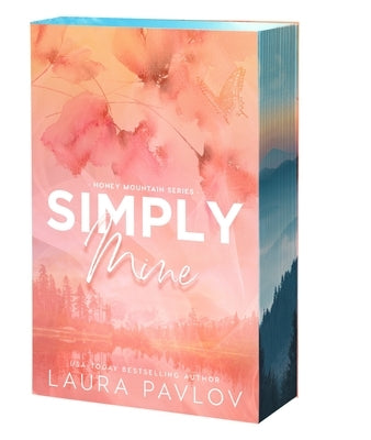 Paperback copy of Simply Mine by Entangled: Amara, featuring the book cover with colorful artwork and title text.