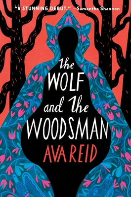 Paperback of The Wolf and the Woodsman by Harper Voyager, featuring the book cover with dark forest and wolf imagery.