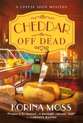 Mass market paperback of Cheddar Off Dead: A Cheese Shop Mystery by St. Martin's Press, showing the book cover with title and author.