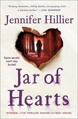 Paperback copy of "Jar of Hearts" thriller novel by Minotaur Books, showing the book cover with dark and mysterious artwork.