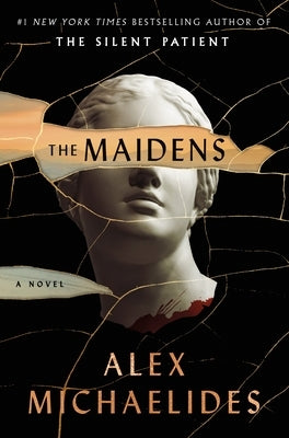 Paperback copy of The Maidens novel by Celadon Books featuring the book cover with dark and mysterious artwork.