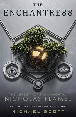Paperback copy of The Enchantress by Ember, showing the book cover with mystical artwork and title on the front.