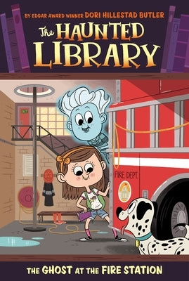 Paperback of The Ghost at the Fire Station by Grosset & Dunlap, showing the book cover with ghostly illustrations and fire station background.