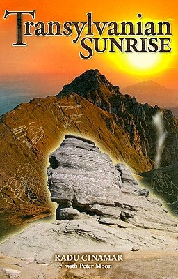 Paperback book titled Transylvanian Sunrise by Sky Books NY, with a cover featuring a sunrise scene and forest landscape.