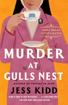 Paperback copy of "Murder at Gulls Nest" by Atria Books, featuring the book cover with title and author details.