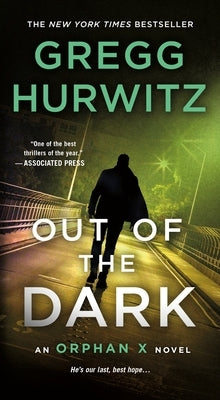 Mass market paperback of "Out of the Dark: An Orphan X Novel" by St. Martin's Press, featuring the book cover with dark and intense artwork.