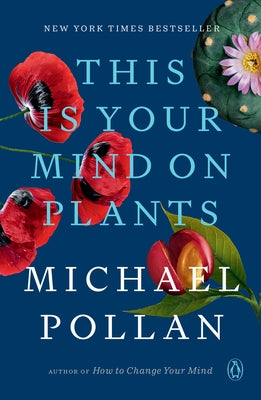 Paperback copy of "This Is Your Mind on Plants" by Penguin Books, featuring a close-up of the book cover with text and design elements.