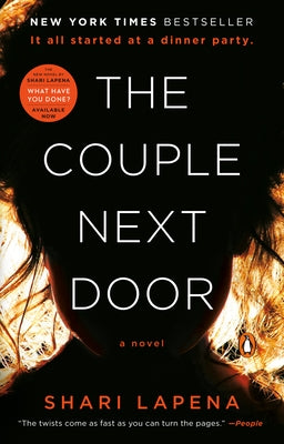 Paperback copy of "The Couple Next Door" novel by Penguin Books, featuring a cover image with title and author details.